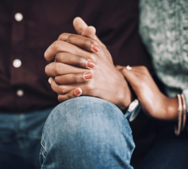 Married couple holding hands, representing marriage counseling in Seattle