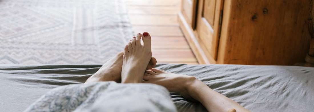 intimacy coach seattle | couple's feet in bed