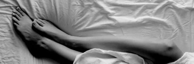 sexual therapist seattle | Feet and legs of a person laying in bed