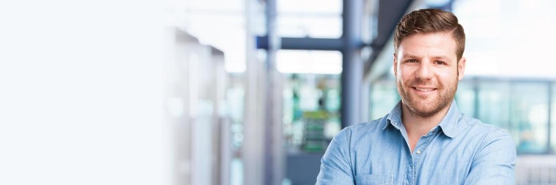 Man smiling in office | Counseling in Seattle WA