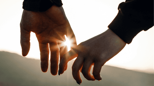 Couple holding hands