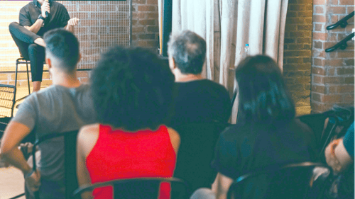 Speaking within panel to crowd in Seattle