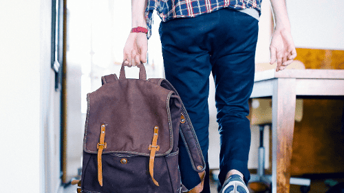 Person with backpack leaving relationship