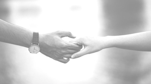 Couple holding hands