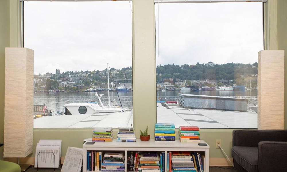 Lake Union view through the windows of a Clarity Counseling Seattle therapy office